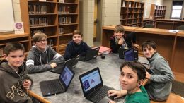 Middle school students coding photo