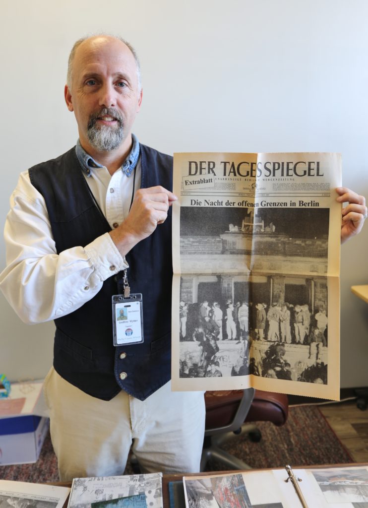 Geoff Wymer hold Berlin newspaper photo